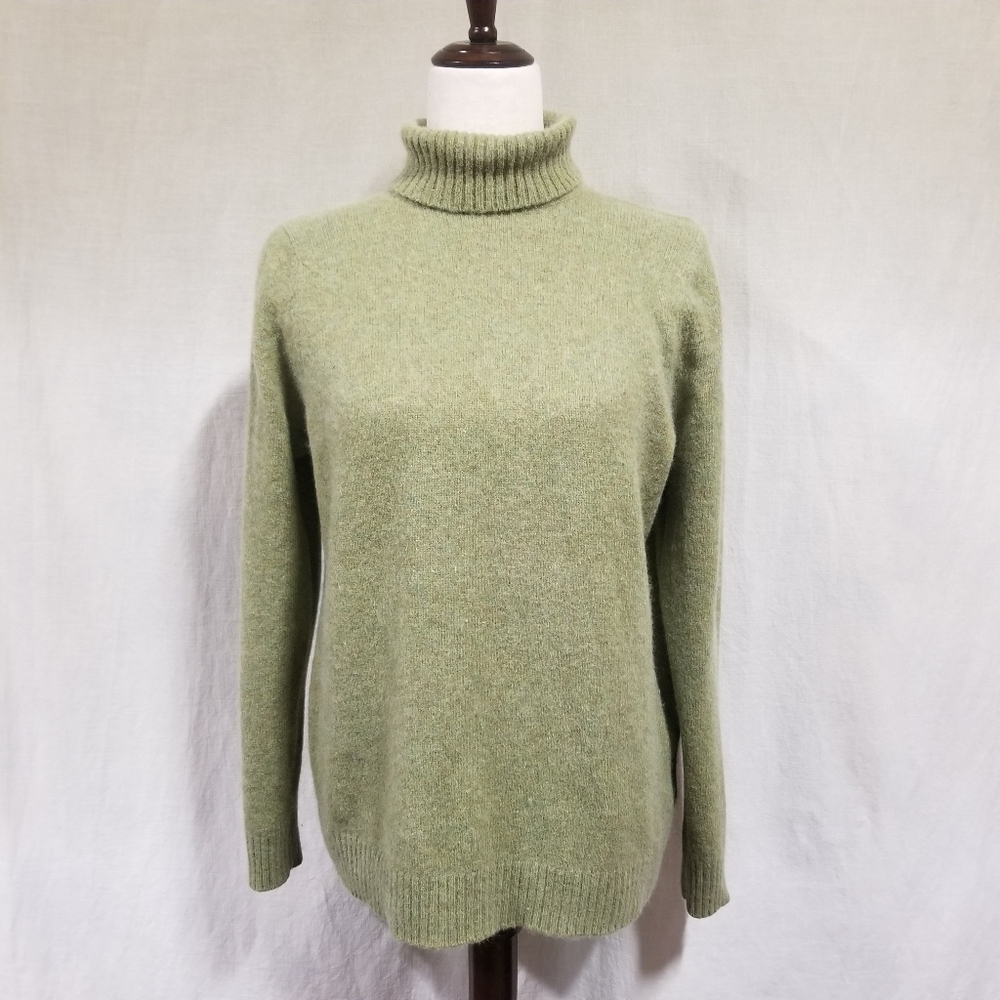 Compliments women's turterneck sweater.           D